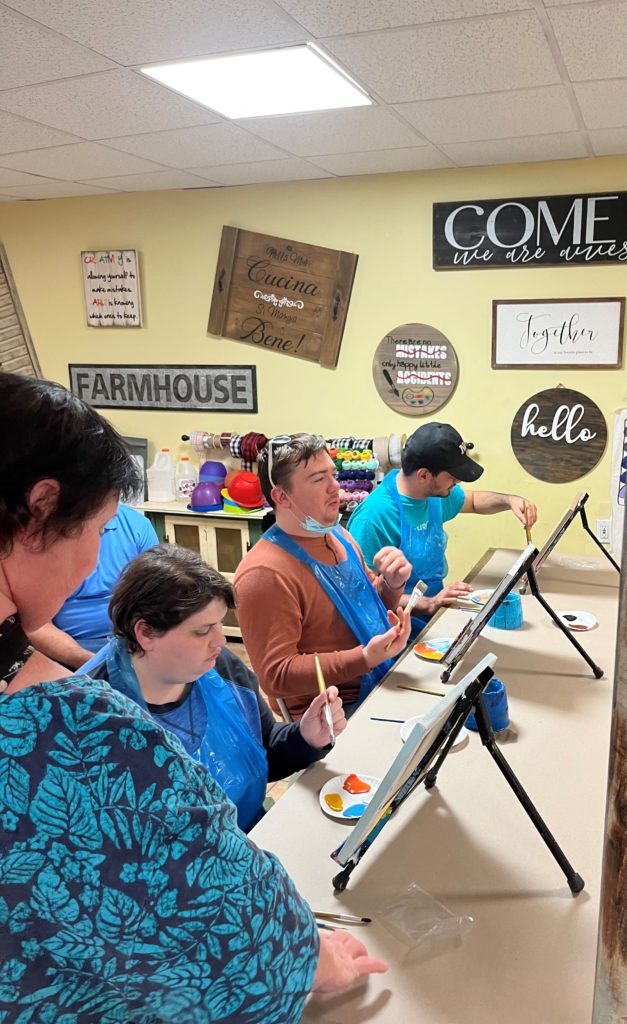 Three Painters Work on Their Art