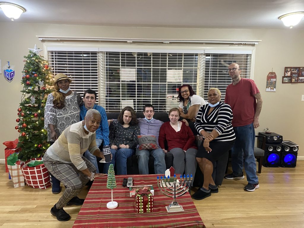 DEF00129-845B-458D-BC7C-1E3FDF814E07 | Citizens Options Unlimited Residents and staff of the Port Washington IRA celebrating Christmas