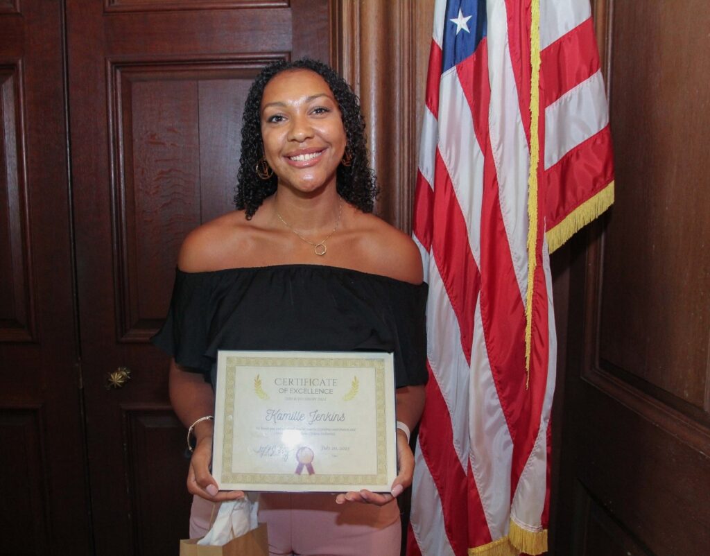 Kamille Jenkins with her Employee of the Quarter certificate