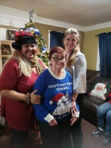 Two Guardianship Coordinators pose with a person supported