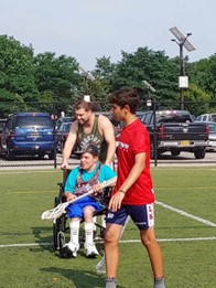 Noah and his teammates play lacrosse