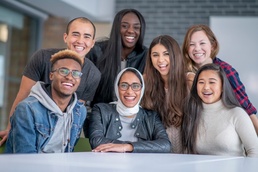 Citizens DEI Photo | Citizens Options Unlimited A photo of a diverse group of young adults at a table
