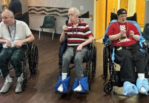Shoreham residents Scott Ardus, Kevin McHugh and Matthew Sullivan enjoy the dance together
