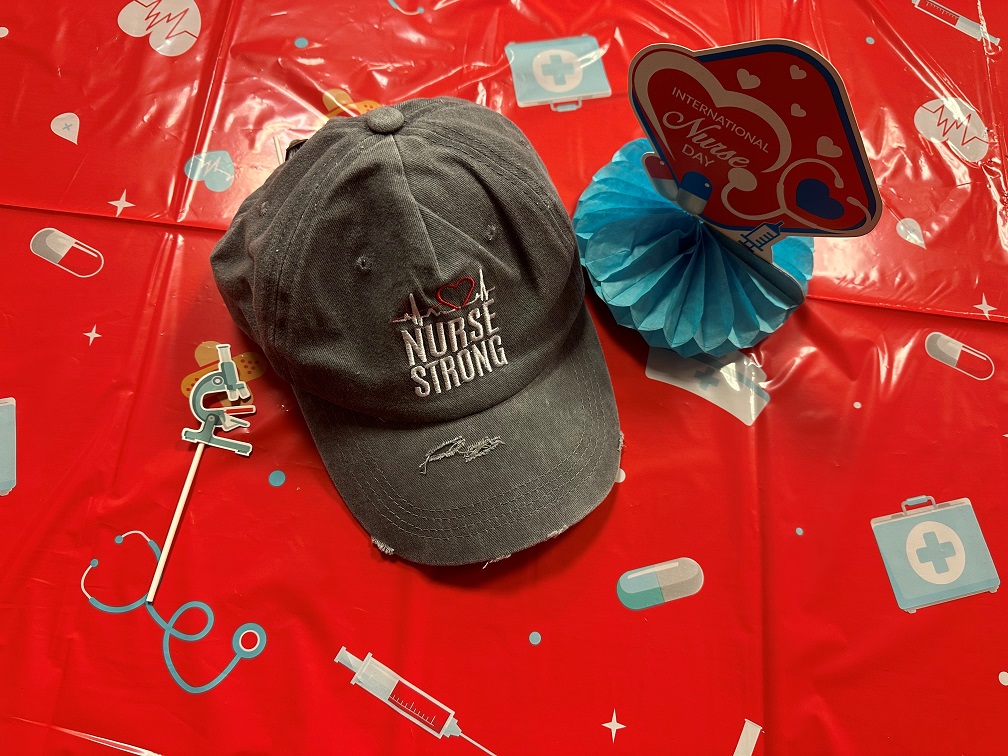 Photo of a baseball cap that reads "Nurse Strong"