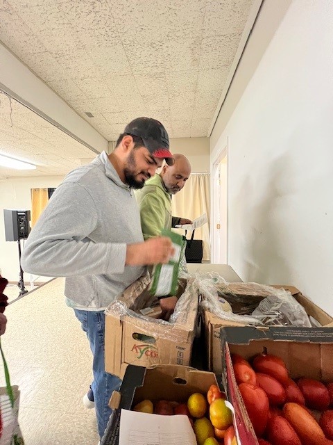 Samuel volunteering 4 | Citizens Options Unlimited Samuel Morles packing food for families who rely on the pantry.