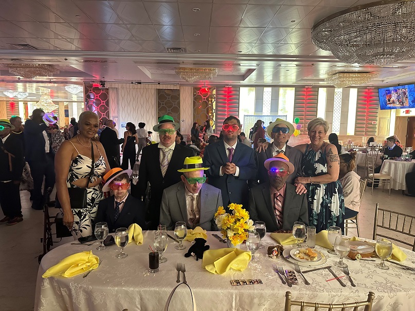 Residents and staff of Ontario Avenue wearing party accessories at the June Jubilee.