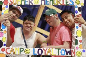Four Camp Loyaltown Campers pose in decorated frame.