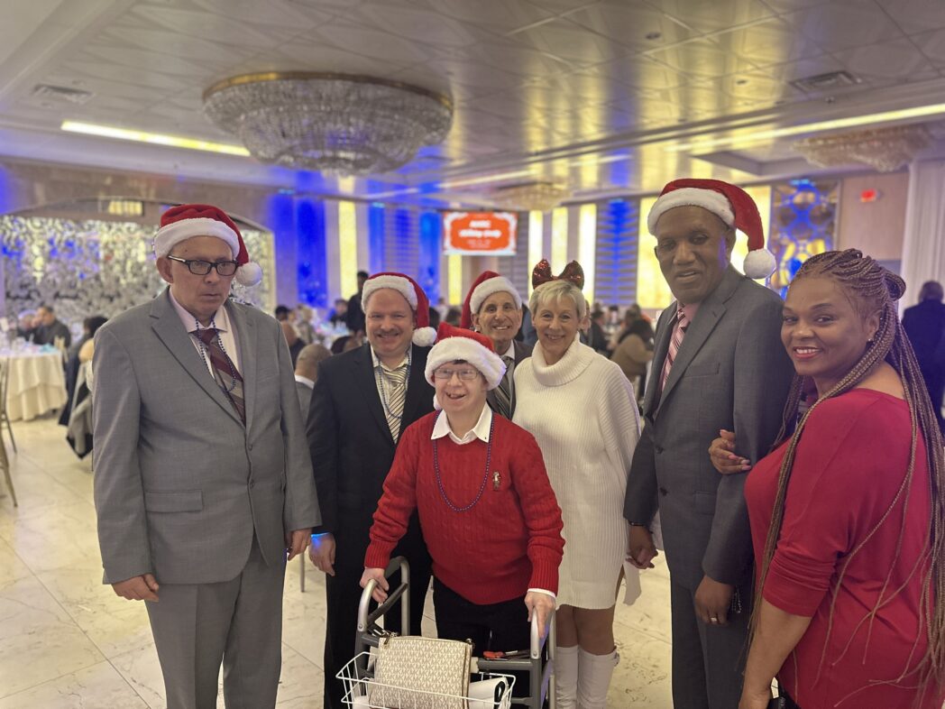 People supported by Citizens Options Unlimited enjoying the holiday party at The Sterling