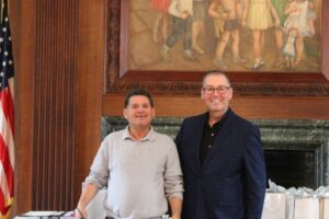 Plainview Office Porter Assistant Richard Sano and Assistant Director of Talent Acquisition, Development and Engagement Jim Stock at the Employee of the Quarter event