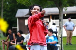 A Camp Loyaltown camper performs at Camp