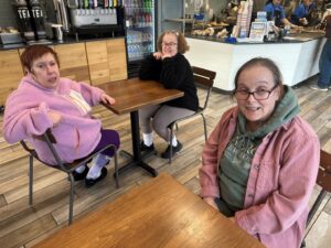 Three Citizens Options Unlimited residents wait for their food at Jersey's Mikes during their day of giving.