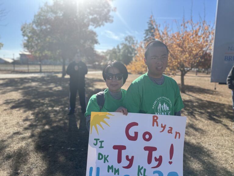 Leng and Tyler Lao Prepare to Walk