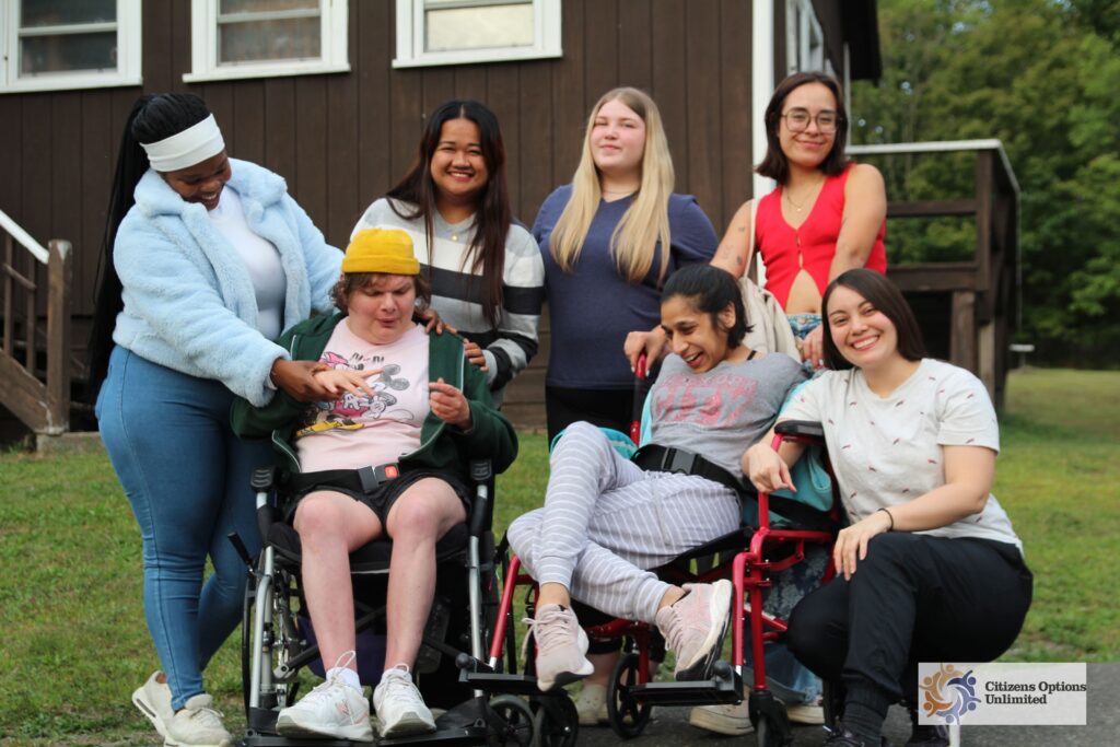 Seven campers and camp counselors at Camp Loyaltown
