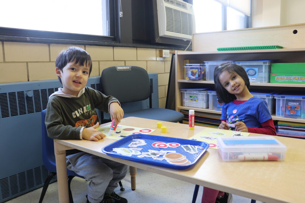 Two Brookville Center for Children's Services students doing arts and crafts