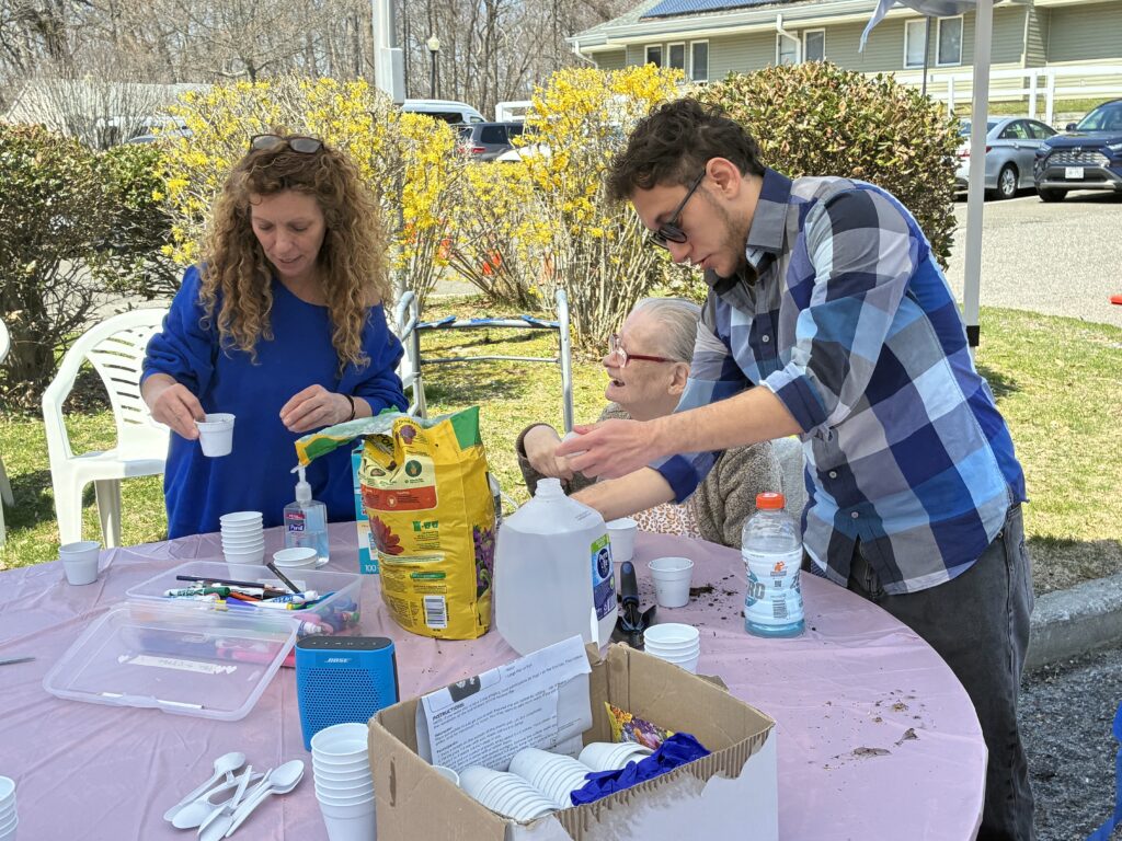 HKP Earth Day 10 | Citizens Options Unlimited Staff at the Helen Kaplan Center help residents plant seedlings.