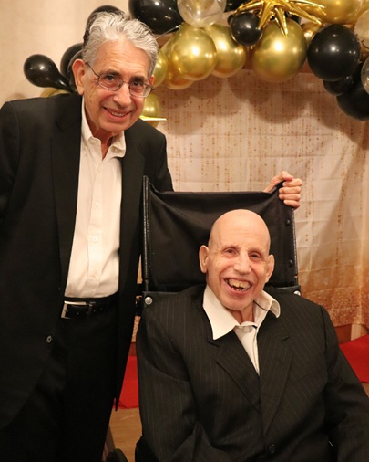 HKP Family Gala 8 - 1 | Citizens Options Unlimited A person supported by Helen Kaplan Center and a family member at the gala.