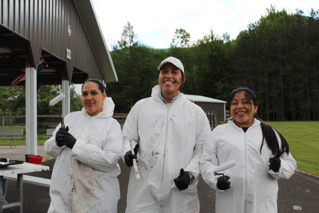IMG_5132 | Citizens Options Unlimited Three Camp Loyaltown counselors with paintbrushes to paint the Camp