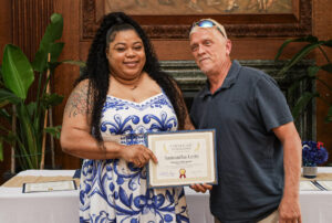 Samantha Letts poses with her Employee of the Quarter award.