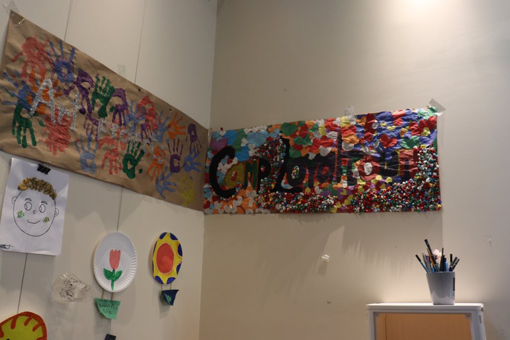IMG_1881 | Citizens Options Unlimited Artwork done by Camp Loyaltown campers hangs on the wall of Mountain Top Library