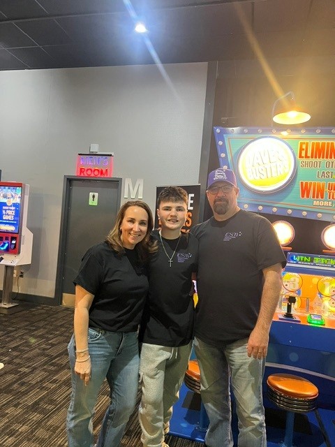Tim Flynn and his family at an arcade.
