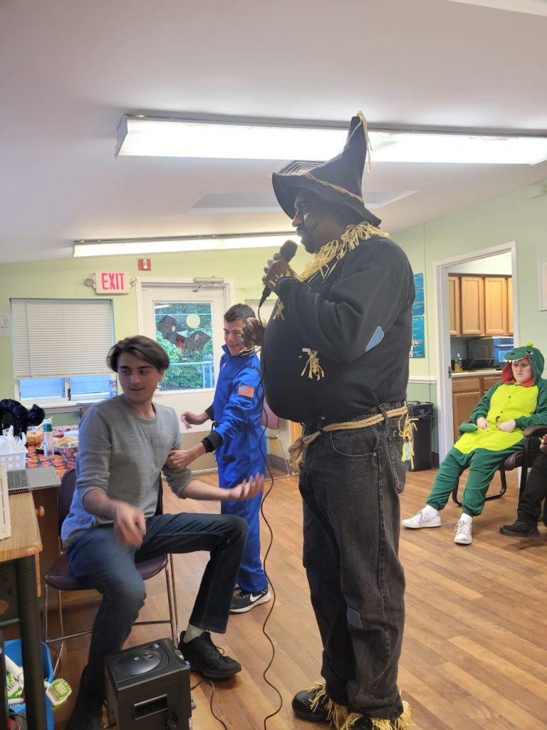 Man Dressed in Scarecrow Costume Does Karaoke