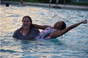 Camper And Counselor Swimming