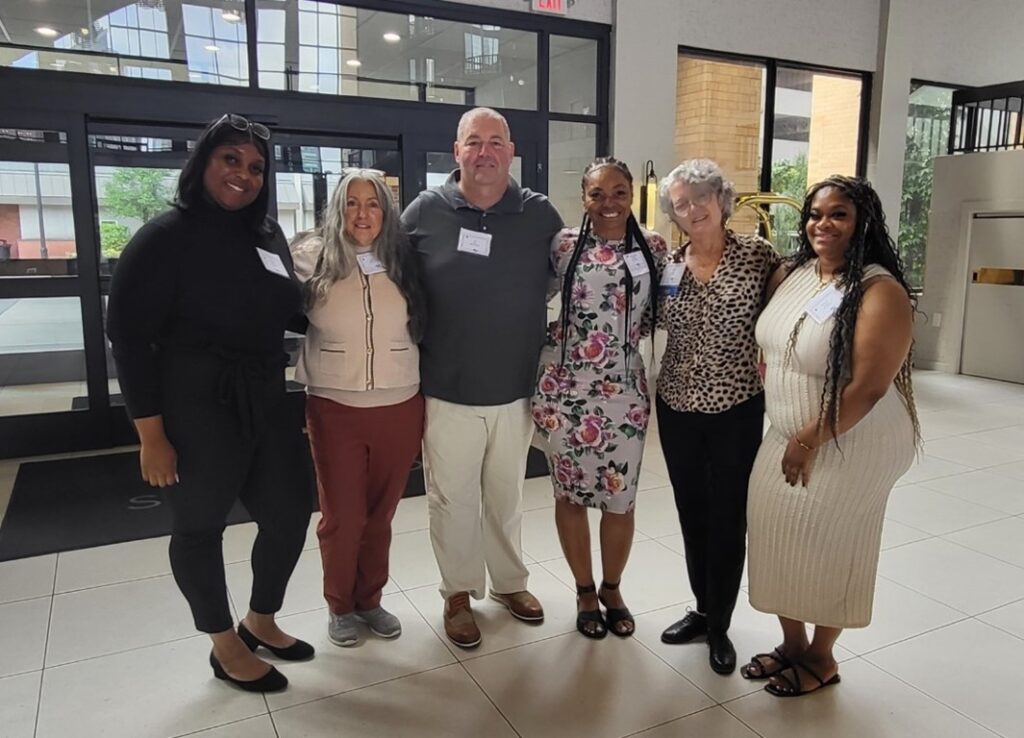 Dapheney Henry poses with colleagues at the NADSP conference