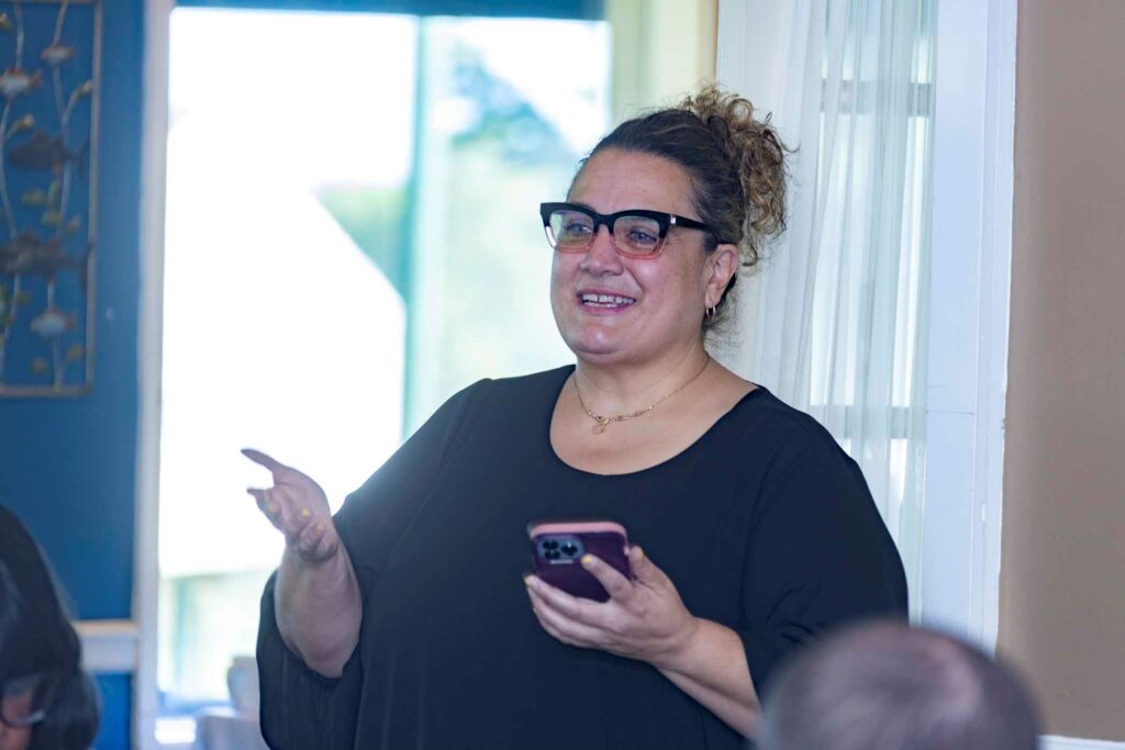 Residential Manager Christine Basile making a speech at the event