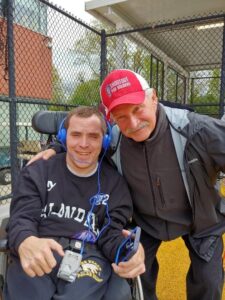 Noah poses with his coach