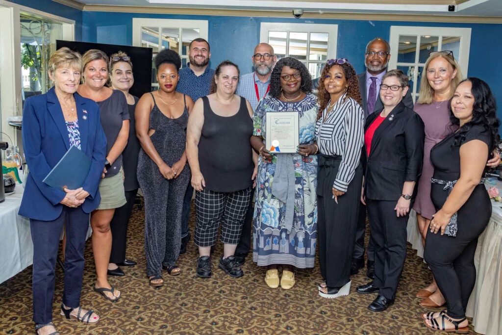 Pickwick staff including DSPs post for a photo with their citation.