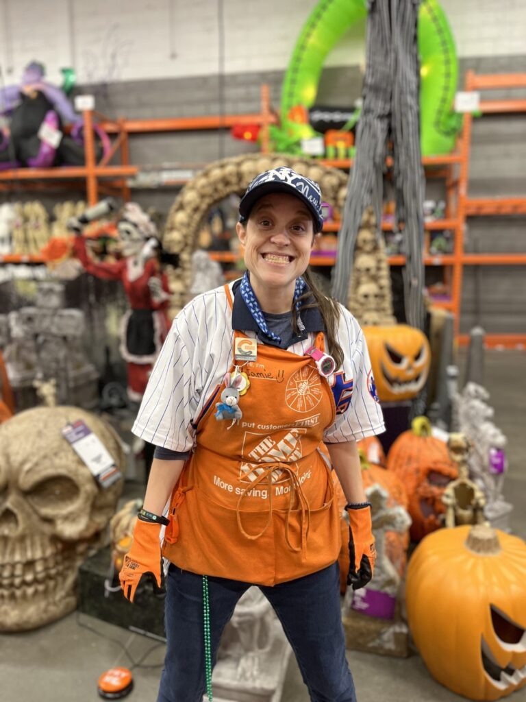 Jamie Allen poses for a photo at her job at Home Depot