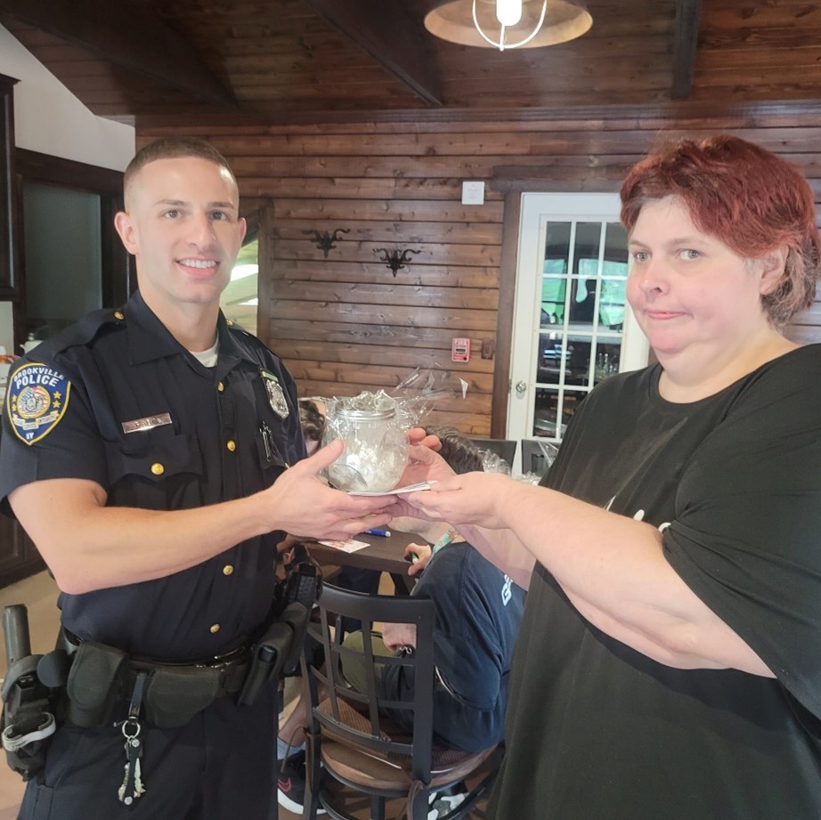 Coleen Mackin and a police officer at the emergency preparedness event for Patriot Day.