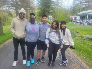 A group of Camp Loyaltown employees pose for a photo at camp