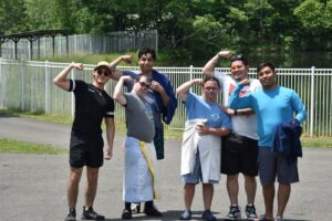Camp Loyaltown Session 1 campers and staff show off their muscles