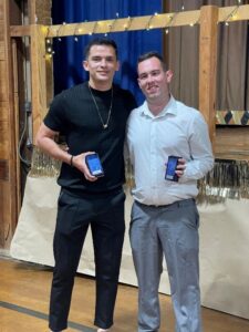 Two Camp Loyaltown staff members pose for a photo at Staff Appreciation Night.