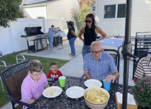 Citizens Options Unlimited residents, staff, and family enjoy a barbecue.
