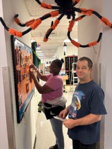 Peter Hadfield and Tamara Morales decorating their office