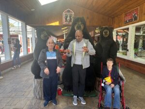 Residents pose like bears with the bear display.