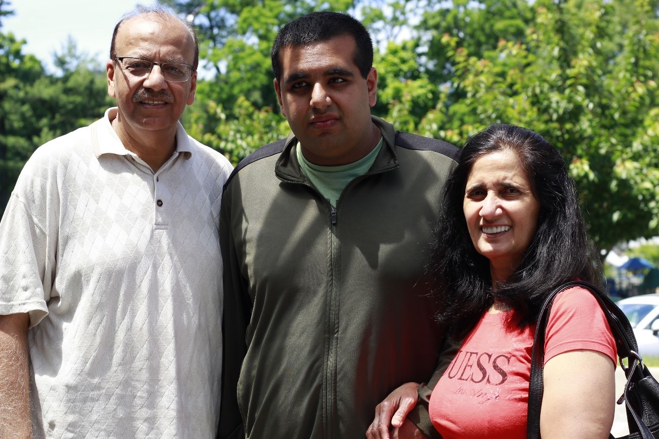 A Camp Loyaltown camper and his family