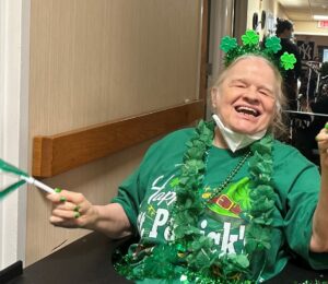Shoreham Intermediate Care Facility resident Patty McCarthy dressed in St. Patrick's Day garb