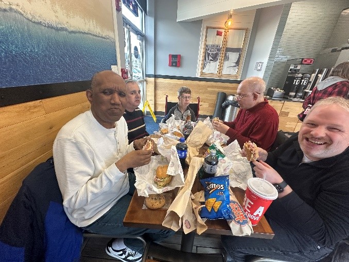 Citizens Options Unlimited residents enjoy their food at Jersey's Mikes during their day of giving.