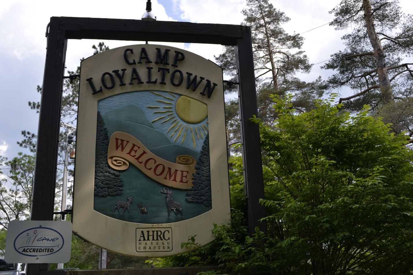 A sign reading "CAMP LOYALTOWN WELCOME"