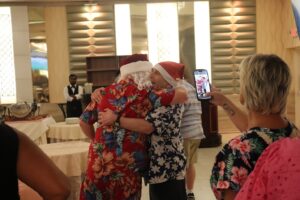 A Citizens resident hugs Santa Claus at the Holly Jolly July party.
