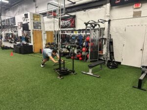 Jonathan Mendel pushes weights at the gym.