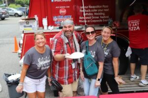 Four Citizens staff members enjoy the pizza truck at Staff Appreciation Day