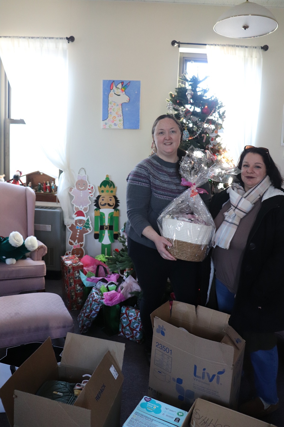 Helen Kaplan Center staff with gifts they donated to MOMMAS House.