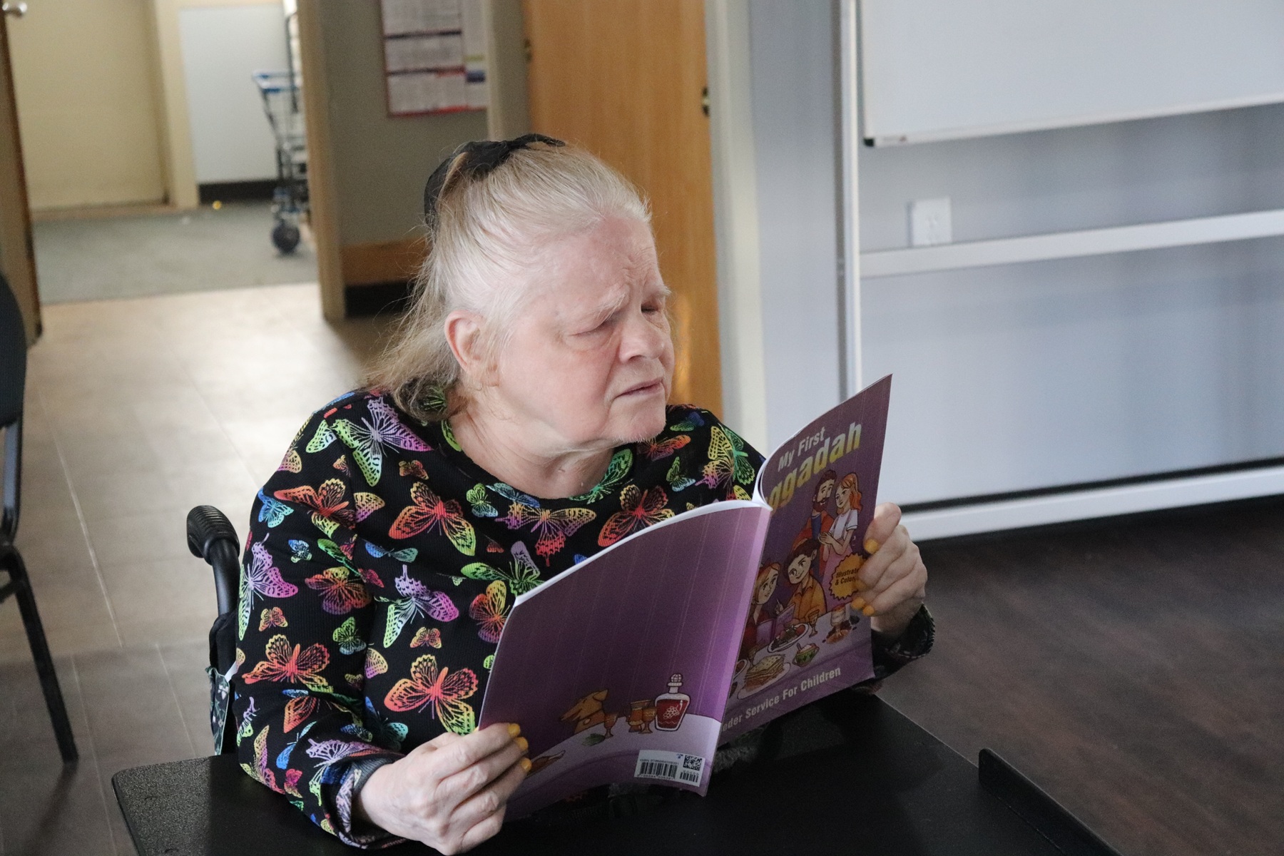 A shore Resident looks at the Haggadah in celebration of Passover